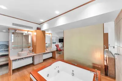 a large bathroom with a tub and a sink at Veranna Lux Apartment in Ialyssos