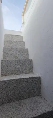 a set of stairs in a white building at Unique Stes Lindos in Líndos