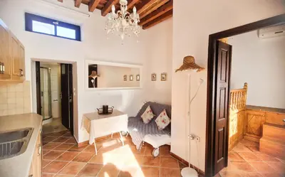 a living room with a couch and a table at Unique Stes Lindos in Líndos