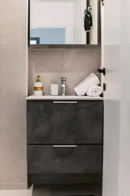 a bathroom with a sink and a mirror at Koskinou Escape Villa in Koskinou