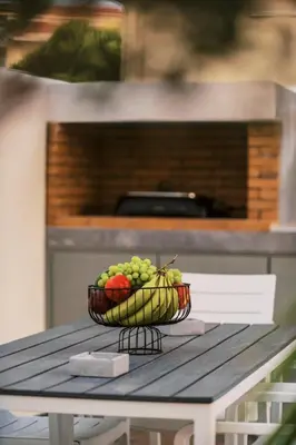 a bowl of fruit sitting on top of a table at Koskinou Escape Villa in Koskinou