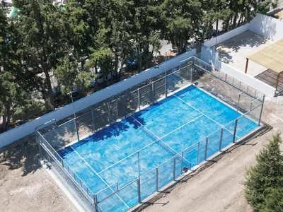 an overhead view of a swimming pool with a metal fence at Delfinia Luxury Residence in Kolimbia