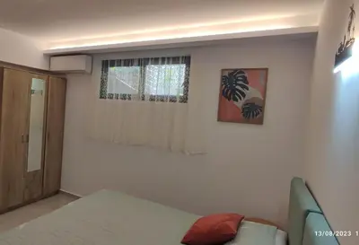 a small room with a bed and a window at Villa Marina apartment Jasmine in Ixia