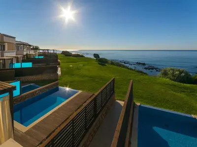 a view of the ocean from the balcony of a house at Al Mare Villas in Kiotari