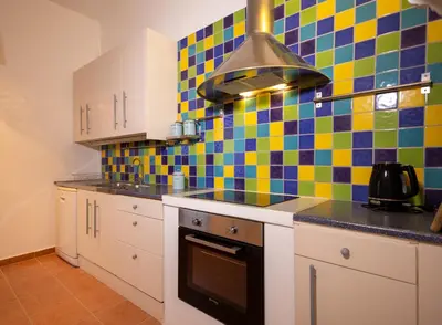 a kitchen with colorful tiles on the wall at Villa Irini in Kallithea Rhodes
