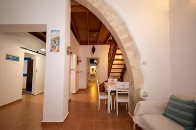 a living room with a table and a dining room at Villa Irini in Kallithea Rhodes