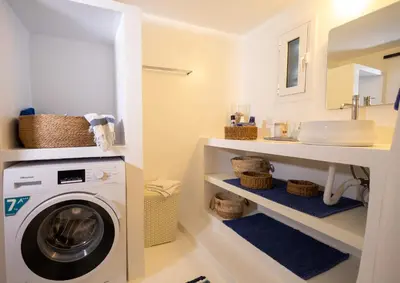 a laundry room with a washer and dryer at Villa Irini in Kallithea Rhodes