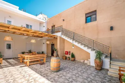 a building with a staircase and a table and a bench at Reborn Luxury Apartments in Rhodes Town