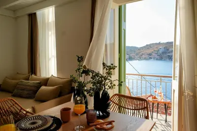 a living room with a view of the ocean at Bella Vista in Symi