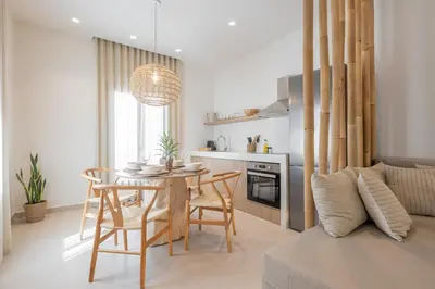 a kitchen and dining room with a table and chairs at The Villa Rhodes Retreat with Private Jacuzzi - Minutes away from Old Town in Rhodes Town