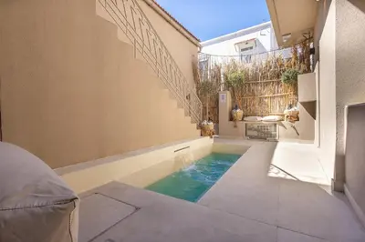 a swimming pool in the floor of a house at The Villa Rhodes Retreat with Private Jacuzzi - Minutes away from Old Town in Rhodes Town