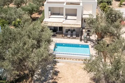 an aerial view of a house with a swimming pool at Villa Frady in Kolimbia