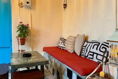 a couch in a room with a table at George&Michael Traditional House in Rhodes Town