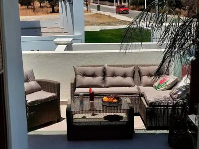 a living room with a couch and a table at Alexa Luxury Suites in Afantou