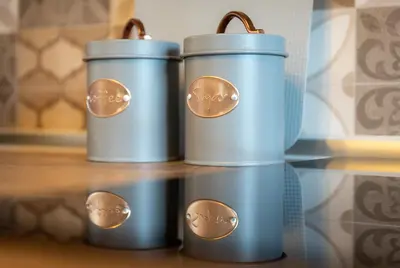 three blue trash cans sitting on a table at Παραδοσιακό Κατάλυμα ΑΜΒΩΝΑΣ in Émbonas