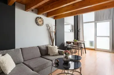 a living room with a couch and a table at Cavo in Ixia