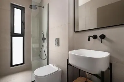 a white bathroom with a sink and a toilet at Mirena Luxury Living-Mirena Villa in Afantou