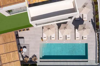 an overhead view of a swimming pool at a resort at Mirena Luxury Living-Mirena Villa in Afantou