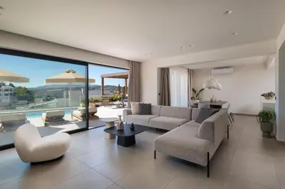 a living room with a couch and chairs at Mirena Luxury Living-Mirena Villa in Afantou