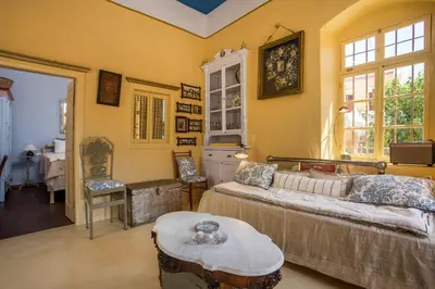 a living room with a couch and a table at kalosymi house,Symi in Symi