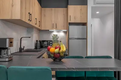 a bowl of fruit on a counter in a kitchen at Tota Suites in Afantou