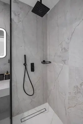 a bathroom with a shower with a shower at Tota Suites in Afantou