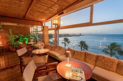 a restaurant with a view of the ocean at La Terrazza Sul Mare in Rhodes Town