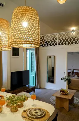 a living room with a large chandelier at Bella Vista II in Symi