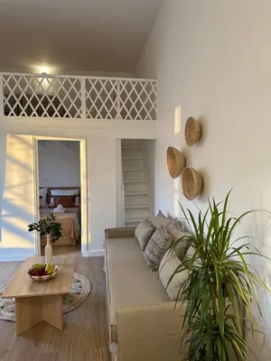 a living room with a couch and a table at Bella Vista II in Symi
