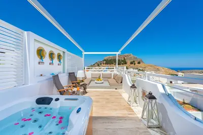 a hot tub on the deck of a yacht at Lindos Allure Villa with Jacuzzi and Acropolis view!!! in Líndos