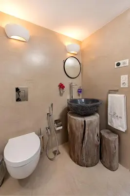 a bathroom with a sink and a toilet at Lindos Allure Villa with Jacuzzi and Acropolis view!!! in Líndos