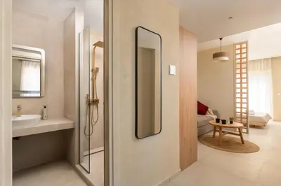 a bathroom with a sink and a mirror at Açai Plant Based Hotel in Rhodes Town