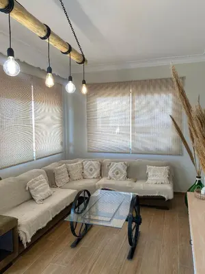 a living room with a couch and a glass table at Bohemian Paradise Villa in Paradeísion