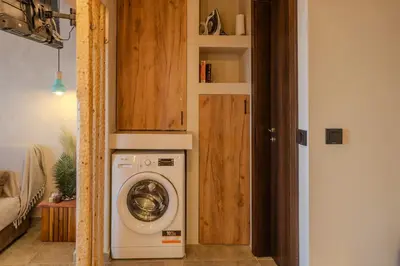 a washer and dryer in a small room at Diamond Seaview Stegna in Archangelos