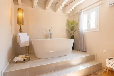 a white bathroom with a sink and a window at Ladino Old Town in Rhodes Town