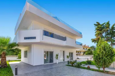 a white house with a lot of windows at Villa Dana by Villa Plus in Ialyssos