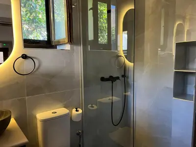 a bathroom with a shower stall and a toilet at Mirodaty's House in Rhodes Town
