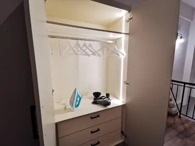 a bedroom with a closet with a desk and hangers at Mirodaty's House in Rhodes Town