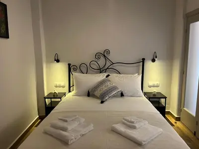 a bedroom with a bed with towels on it at Mirodaty's House in Rhodes Town
