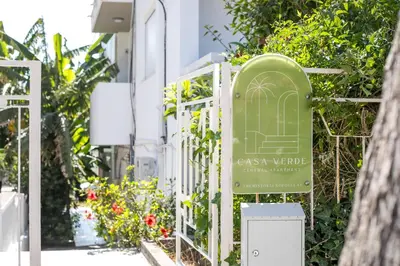 a sign for a garden outside a building at CasaVerde Central Apartment in Rhodes Town