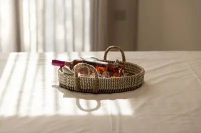 a wicker basket sitting on top of a table at Kallithea Blue in Koskinou