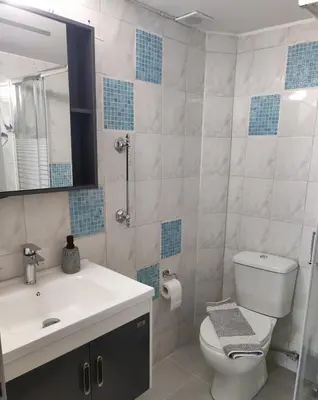 a bathroom with a toilet and a sink and a mirror at Koskinou Residence in Koskinou