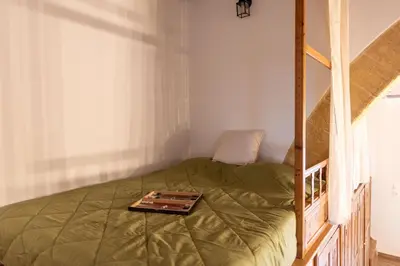 a bedroom with a bed with a tray on it at La Casa di Varvara e Nikolas in Soroni