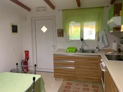 a kitchen with a sink and a window at SERENITY House in Faliraki