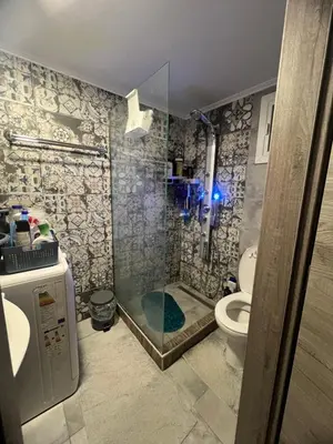 a bathroom with a shower and a toilet at Cozy Rhodes Studio in Rhodes Town