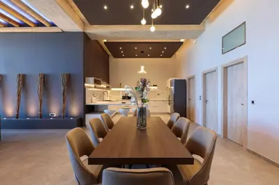 a dining room with a table and chairs at Evie's Oasis in Ixia