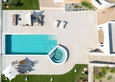 an overhead view of a swimming pool with a pool house at Ralu Villa - Faliraki & Traganou Beach in Kalithies