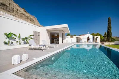 a villa with a swimming pool and a house at Mira Villa - Faliraki & Traganou Beach in Kalithies