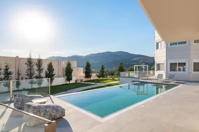 a swimming pool in the backyard of a house at Mira Villa - Faliraki & Traganou Beach in Kalithies