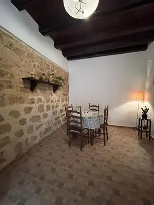 a dining room with a table and some chairs at Zoe House-Old Town in Rhodes Town